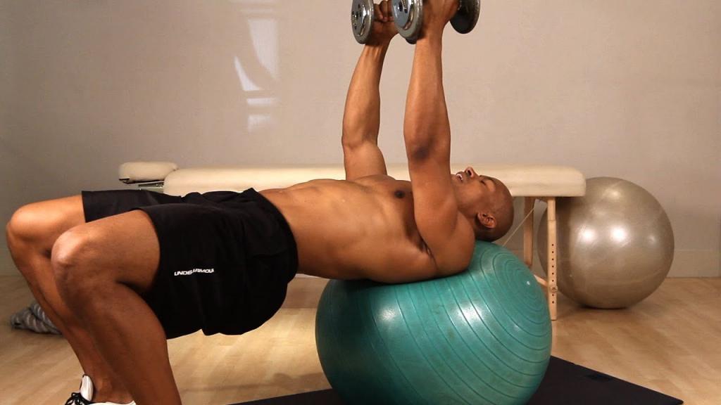 Dumbbell chest fly exercise using a stability ball 